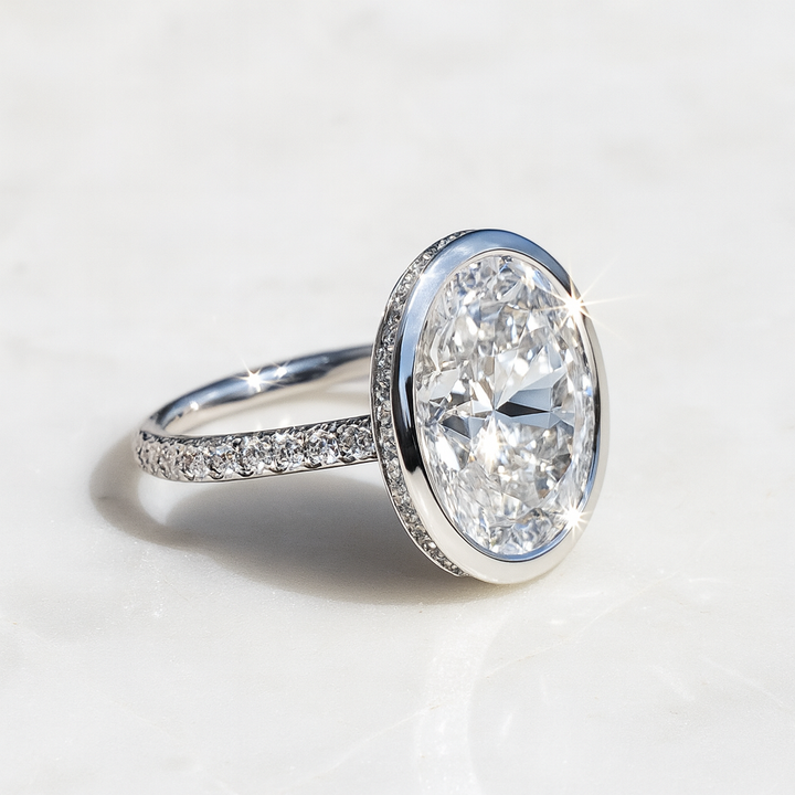 Bezel Set Oval Diamond Engagement Ring with Diamond Band
