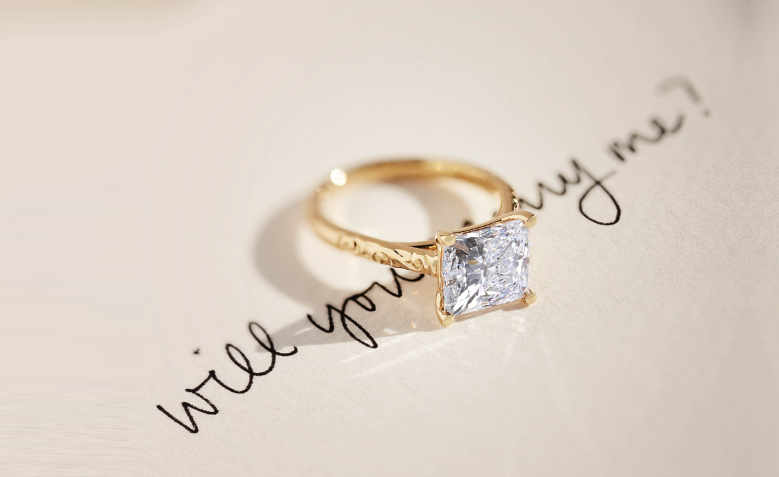 yellow gold princess cut engagement ring with hand engraving jewelry store dallas