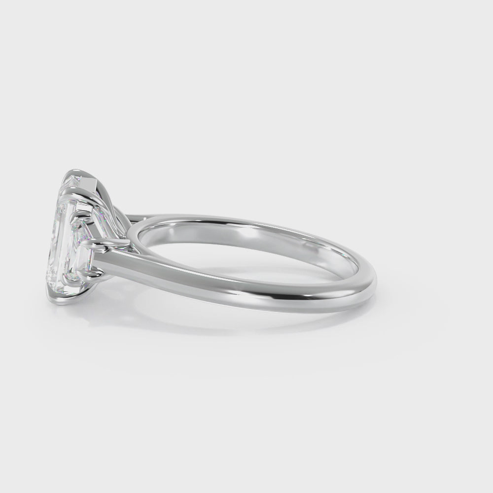 Emerald and Trapezoid Three Stone Diamond Ring | Dallas